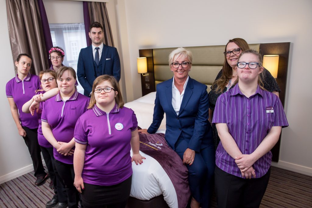 Photo of staff and students from Derwen College and Premier Inn