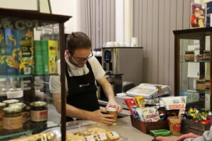 Hospitality and Food student preparing a drink at the Station Cafe