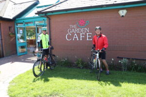 Cyclists outside the Walled Garden Cafe