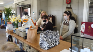 Students serving a customer in The Vintage Advantage at Derwen College