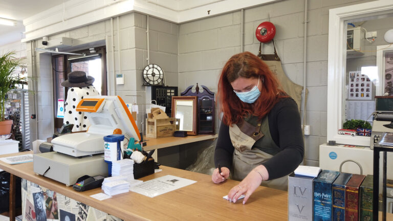 Student working in the charity shop