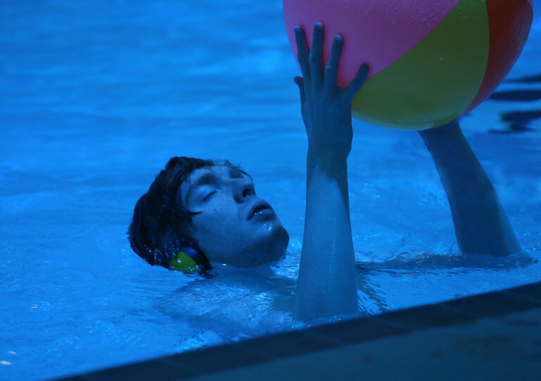 Hydrotherapy pool - student with a ball