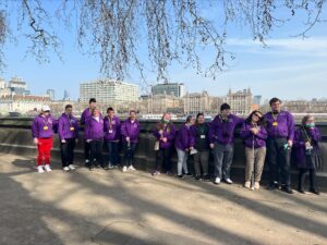 All of the Student Union Board lined up in front of a sunny London skyline.