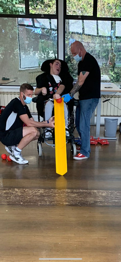 Nurture student playing boccia