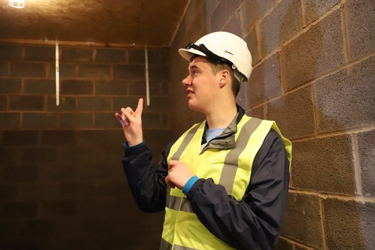 Ben (wearing high vis jacket and hard hat) in the hydro pool st Derwen when it was being built.