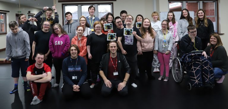 Group photo of Martin Portlock with Performing Arts students