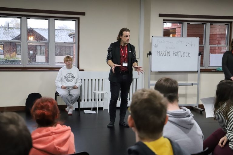 Martin talks to seated students