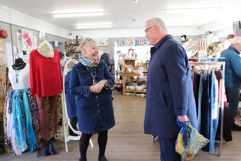 Richard chats to Derwen charity shop employee Karen Hughes in the charity shop.