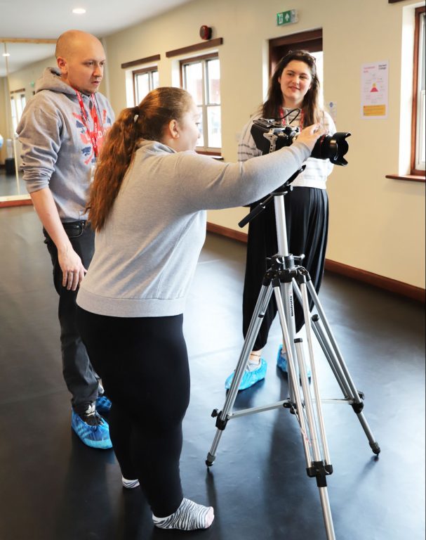 Rocking Horse founder Gareth and actress Orla show a student how to use the video camera.