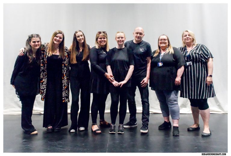Performing Arts staff, work experience team, supported intern Anna and Gareth from Rocking Horse in a group shot, dressed in black and smiling.