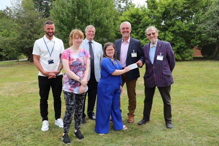 Sports and Leisure Coordinator Steve Evans, and students Anna and Ciara, accepted a cheque for £1,800 from Peter Robinson (SMCA), Rick Gerard (Lodge of St Oswald) and David Towers (Lodge of St Oswald). Stood outside on the grass