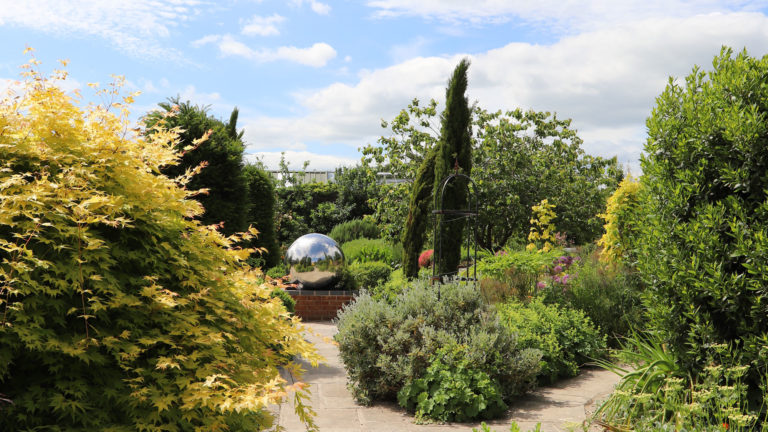 garden with silver sphere ornament