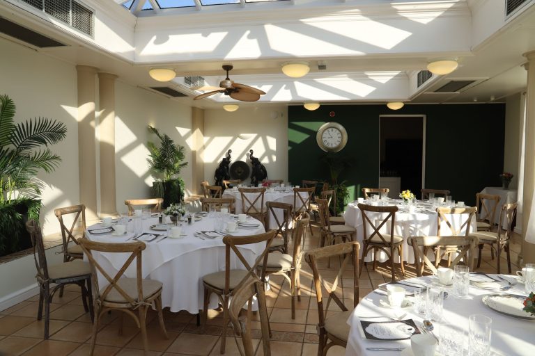 tables and chairs laid out in the orangery Restautant
