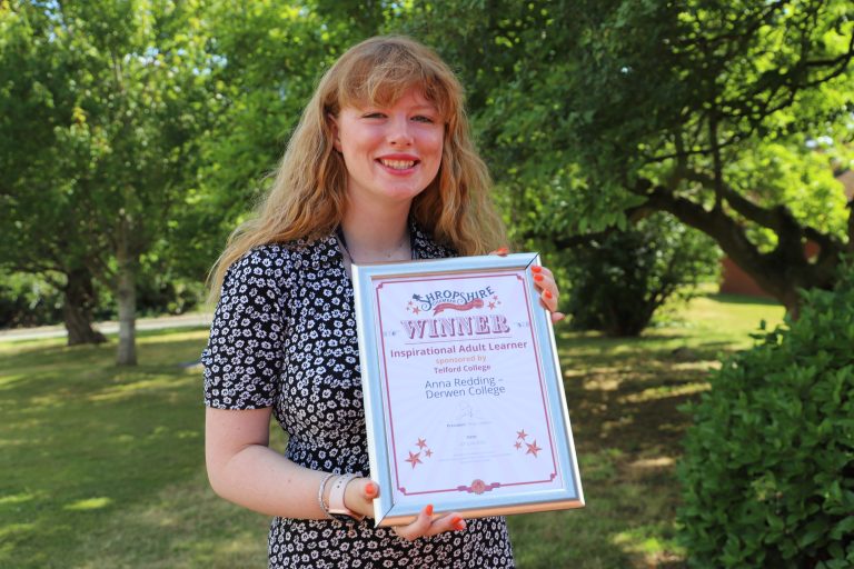 Student Anna smiling and holding a certificate which says Shropshire Chamber Awards Inspirational Adult Learner Winner.