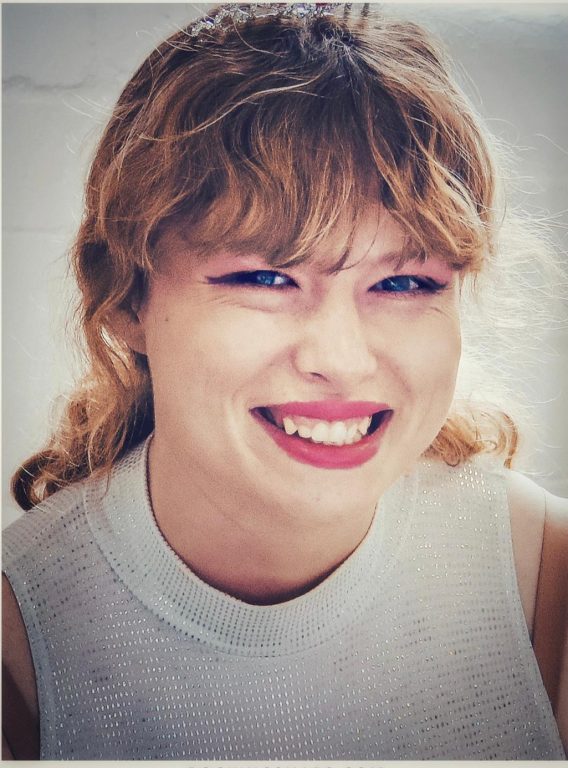 head and shoulders photo of a smiling young student