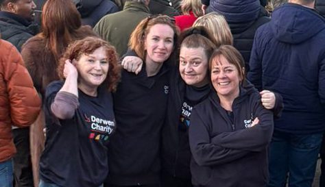 Derwen College staff walk on fire to raise over £800