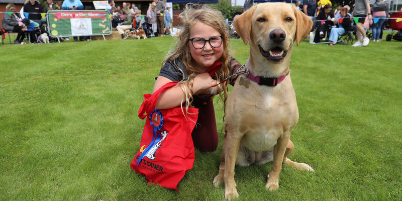 a girl and a dog at the fete and dog show