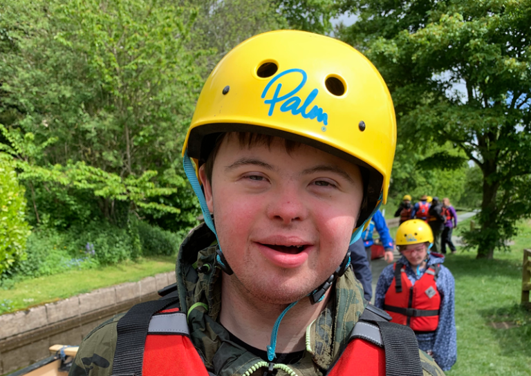 Luke wearing canoe helmet