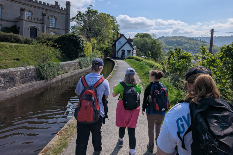 Silver participants walk on the towpath along the canal for their expedition