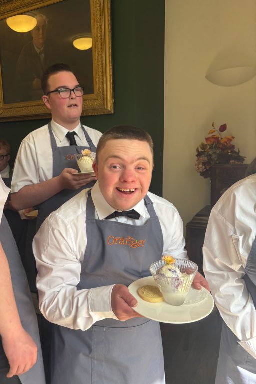 Student holding an ice cream for HRH Duke of Edinburgh visit