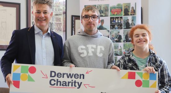 Karl (left) presents a cheque for £1,200 to students Jonathan and Claudia