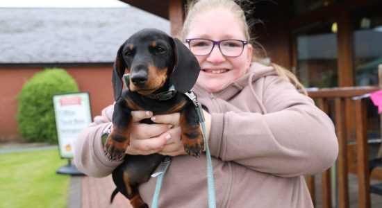 Student Isabelle with Rusty who got third place in the best puppy category